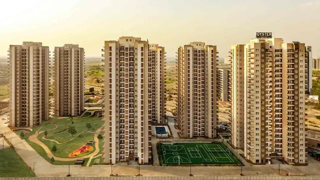 Adani Oyster Grande - aerial of towers with sports courts (real photo) thumbnail
