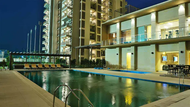Adani Oyster Grande - pool and clubhouse at dusk (real photo) thumbnail