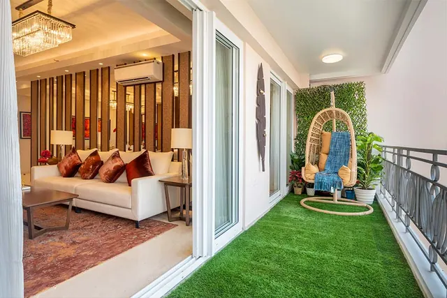 DLF Sky Court - living room and balcony thumbnail