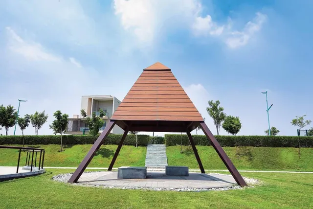 Experion The Westerlies - Timber pyramid pavilion in landscaped park, actual photo thumbnail