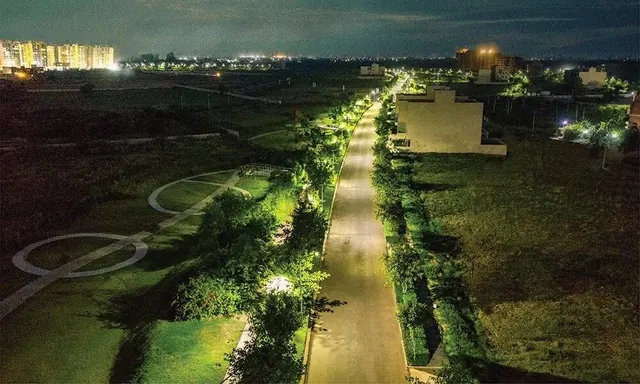 Experion The Westerlies - Lit internal road at night, actual photo thumbnail