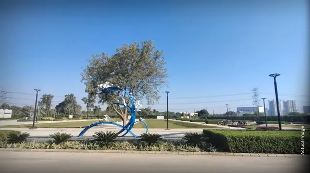 M3M 114 Market - actual site photo - sculpture and greens thumbnail