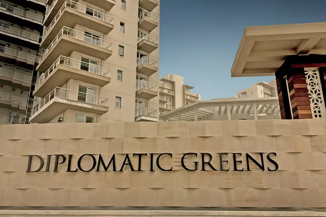 Puri Diplomatic Greens - entrance signage with towers (real photo) thumbnail