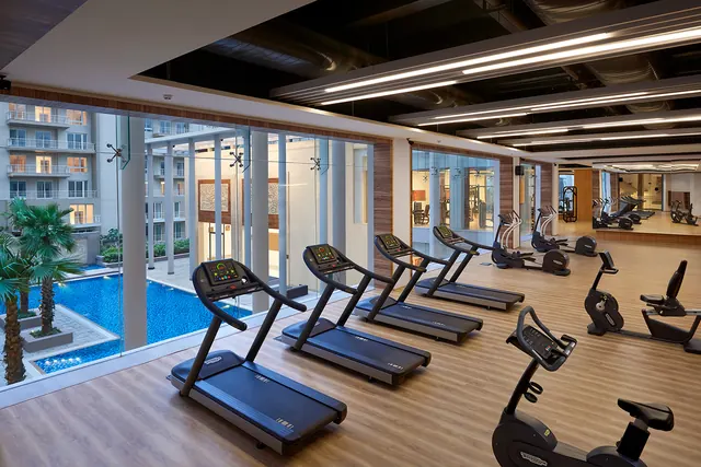 Puri Diplomatic Greens - gym overlooking pool (real photo) thumbnail