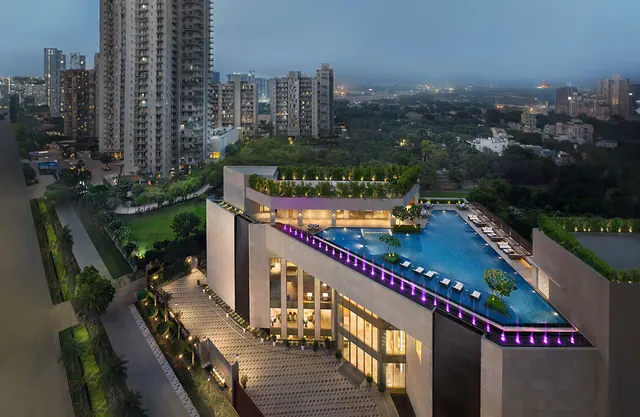 Puri Diplomatic Residences - clubhouse with infinity pool, aerial at dusk (real photo) thumbnail