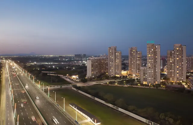 Puri Diplomatic Residences - towers and Dwarka Expressway at dusk (real photo) thumbnail