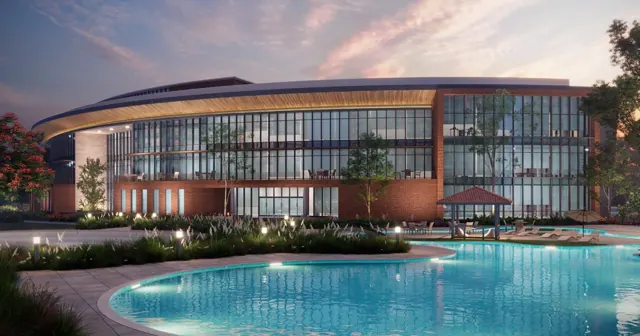Sobha Aranya Gurgaon - Clubhouse and pool at dusk thumbnail