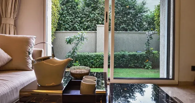 Sobha International City - living room opening to private garden (interior) thumbnail