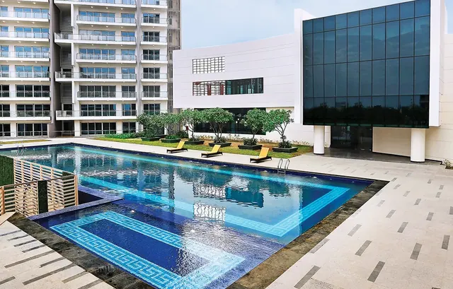 Tata Gurgaon Gateway - outdoor pool with towers (actual photo) thumbnail
